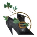 An old-fashioned pointed shoe with a gold buckle entwined with shamrock clover leaves. Vintage and retro style. Isolated Royalty Free Stock Photo