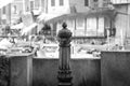 Old-fashioned public fountain. Black and white photo