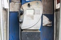 Old fashioned public pay phone in telephone box Royalty Free Stock Photo