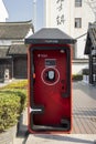 Old fashioned public telephone on a street in Shanghai