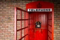 Old Fashioned Red Telephone Booth with Open Door Royalty Free Stock Photo