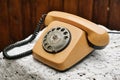 Old-fashioned retro style telephone with rotary dial. Vintage phone. Royalty Free Stock Photo