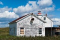 Old-fashioned rustic house and lighthouse Royalty Free Stock Photo