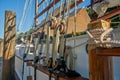 Old fashioned sailing boats moored alongside waterfront pier on Mahurangi River Royalty Free Stock Photo