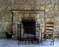 Old fashioned scene with a vintage stone fireplace Royalty Free Stock Photo