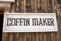 Old fashioned sign for a Coffin Maker, made of wood. Taken in Fairplay, Colorado