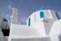 Old fashioned small Greek chapel on the holiday island of Ios. Dramatic low angle view Royalty Free Stock Photo