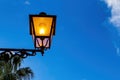 Old-fashioned Street Lamp in the Evening. A Brightly lit Street Lamp on a building in Italy. Decorative lamps. Magic Lamp with Royalty Free Stock Photo