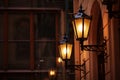 Old fashioned street lamp at night. Brightly lit street lamps at sunset. Decorative lamps. Magic lamp with a warm yellow light in