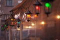 Old fashioned street lamp at night. Brightly lit street lamps at sunset. Decorative lamps. Magic lamp with a warm yellow light in Royalty Free Stock Photo