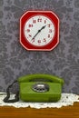 Old fashioned telephone and clock Royalty Free Stock Photo