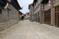 Old-fashioned tile-roofed buildings by stone street