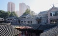 Old-fashioned tile-roofed buildings in sunny morning