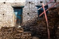 Old fashioned traditional dirty wood window and door in small mountain village in Nepal Royalty Free Stock Photo