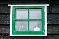 Old fashioned traditional wood window and wooden black wall in Amsterdam, The Netherlands