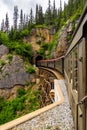 Old fashioned train crossing wooden bridge Royalty Free Stock Photo