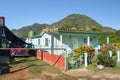 Old fashioned vintage car by summer colorful house in the town of Vinales, Cuba Royalty Free Stock Photo