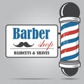 Old fashioned vintage glass Barber Shop pole with Barber Sign.