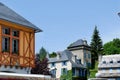 Old fashioned vintage houses in the vivid greenery at summertime in Arreau village, Pyrenees mountains, south of France Royalty Free Stock Photo