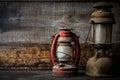 Old fashioned vintage kerosene oil lantern lamp burning with a soft glow light with aged wooden floor Royalty Free Stock Photo