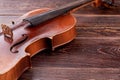 Old-fashioned violin on wooden background. Royalty Free Stock Photo