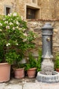 Old fashioned water fountain in the Tuscan hillside town of Barberino Val D`Elsa.