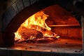 an old-fashioned wood-fired oven with vivid flames