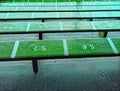 Empty wooden benches at rugby stadium