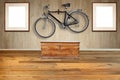 Wooden chest against textured wood wall with a Hanging road bike Royalty Free Stock Photo