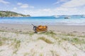 Old-fashioned wooden clinker dinghy pulled on beach Royalty Free Stock Photo