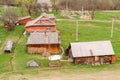 Old-fashioned wooden houses on the outskirts of the forest. Among the Carpathian mountains in Ukraine. Selective focus. Outdoors. Royalty Free Stock Photo