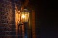 Old fashoned glass wall mounted lantern on a brick wall Royalty Free Stock Photo