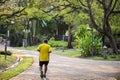 Old fat man run in park at morning