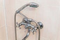 Old faucet the faucet Assembly in the bathroom. Limescale on chrome taps and mixer shower Royalty Free Stock Photo