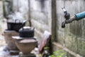 Old faucet with water leaking drop to the ground Royalty Free Stock Photo