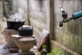 Old faucet with water leaking drop to the ground Royalty Free Stock Photo