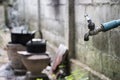 Old faucet with water leaking drop to the ground Royalty Free Stock Photo