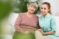 Old female with professional caregiver Royalty Free Stock Photo