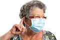 Old female touching ear listening gesture wearing covid19 mask