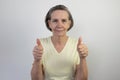 Old female woman senior happy smile thumbs up retired aged expression friendly