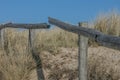 Old fence in the dunes of the North sea Royalty Free Stock Photo