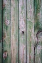 Old fence made of wooden planks, in the style of rustic, grunge, worn gray-green color with nails Royalty Free Stock Photo