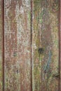 Old fence made of wooden planks, in the style of rustic, grunge, worn gray-green color with nails Royalty Free Stock Photo