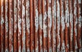 Old fence. Red ancient surface texture wooden vintage wall wallpaper door background. Wooden fencing with old paint Royalty Free Stock Photo