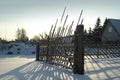 Old fence in snowy countryside