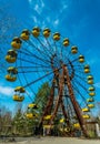 Old ferris wheel in the ghost town of Pripyat. Consequences of the accident at the Chernobil nuclear power plant