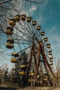 Old ferris wheel in the ghost town of Pripyat. Consequences of the accident at the Chernobil nuclear power plant