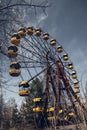 Old ferris wheel in the ghost town of Pripyat. Consequences of the accident at the Chernobil nuclear power plant
