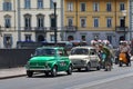 Old Fiat 500 and Vespa scooter and motorcycle parade through Florence