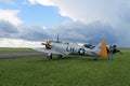 Old fighter american plane on green field side view Royalty Free Stock Photo